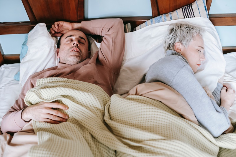 CBD Melatonin Gummies Couple Sleeping in Bed