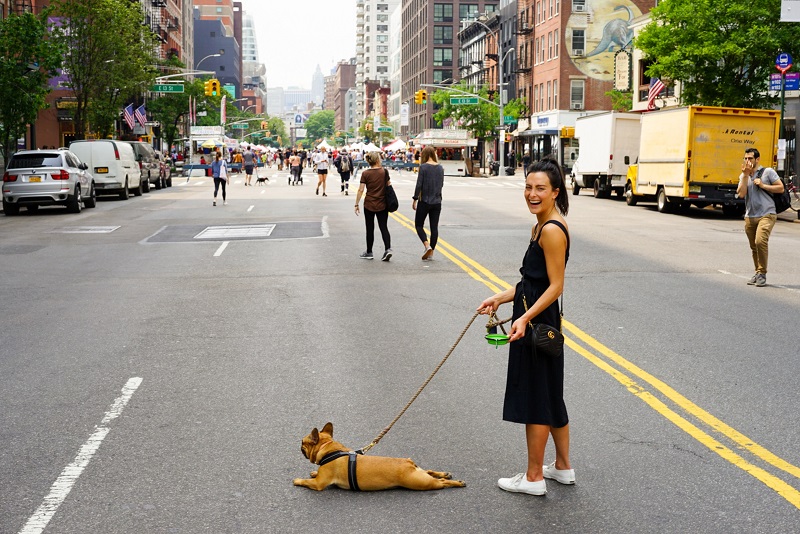 CBD Dosage Woman Walking Her Dog in a City