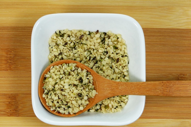 What is Hemp Used for Medically Overhead View of a Plate with Hemp Seeds and a Wooden Spoon