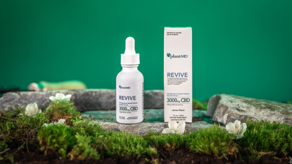 3000mg Tincture for Those who Need a Higher CBD Dosage PlantMD Revive Tincture Sitting on Natural Wood with Moss