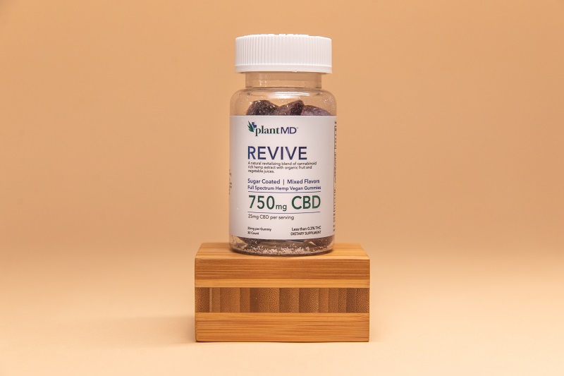 Difference Between CBD Isolate Gummies and Full Spectrum Gummies a Bottle of PlantMD Revive Gummies in a Stock Photo